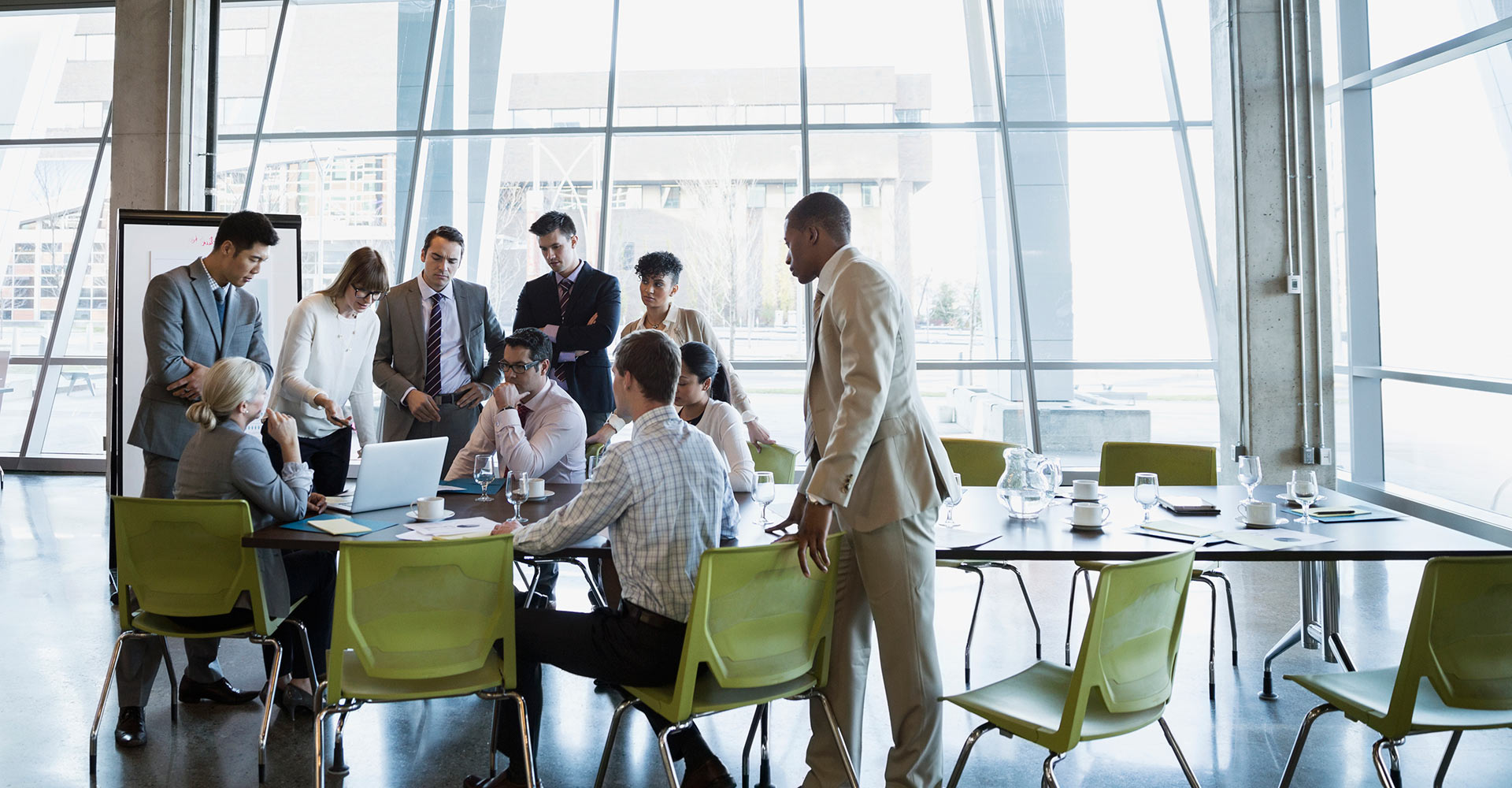 Image of a team reviewing a proposal from McCord Web Services in a conference room.