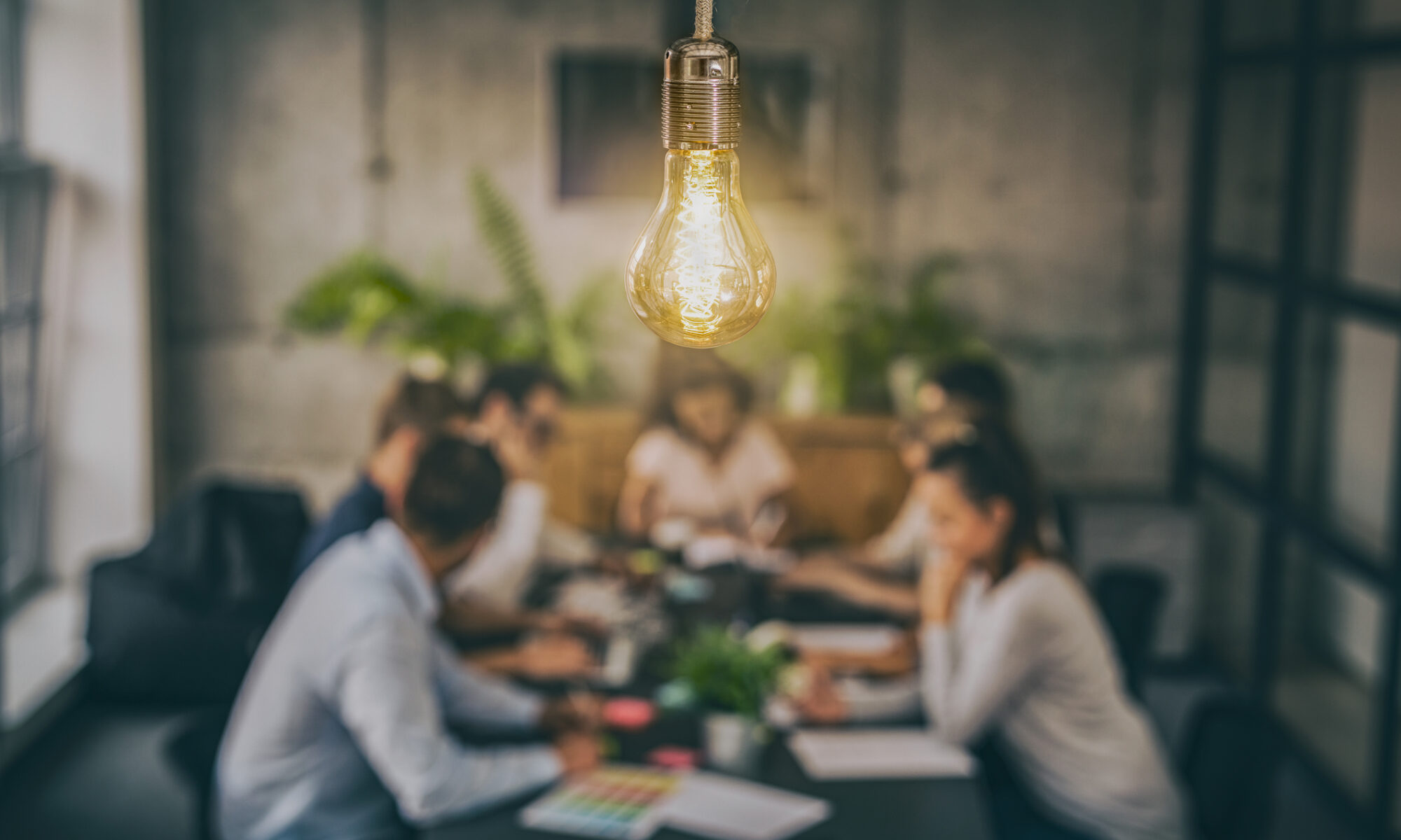 Lightbulb In Front of a First Party Advertising Team