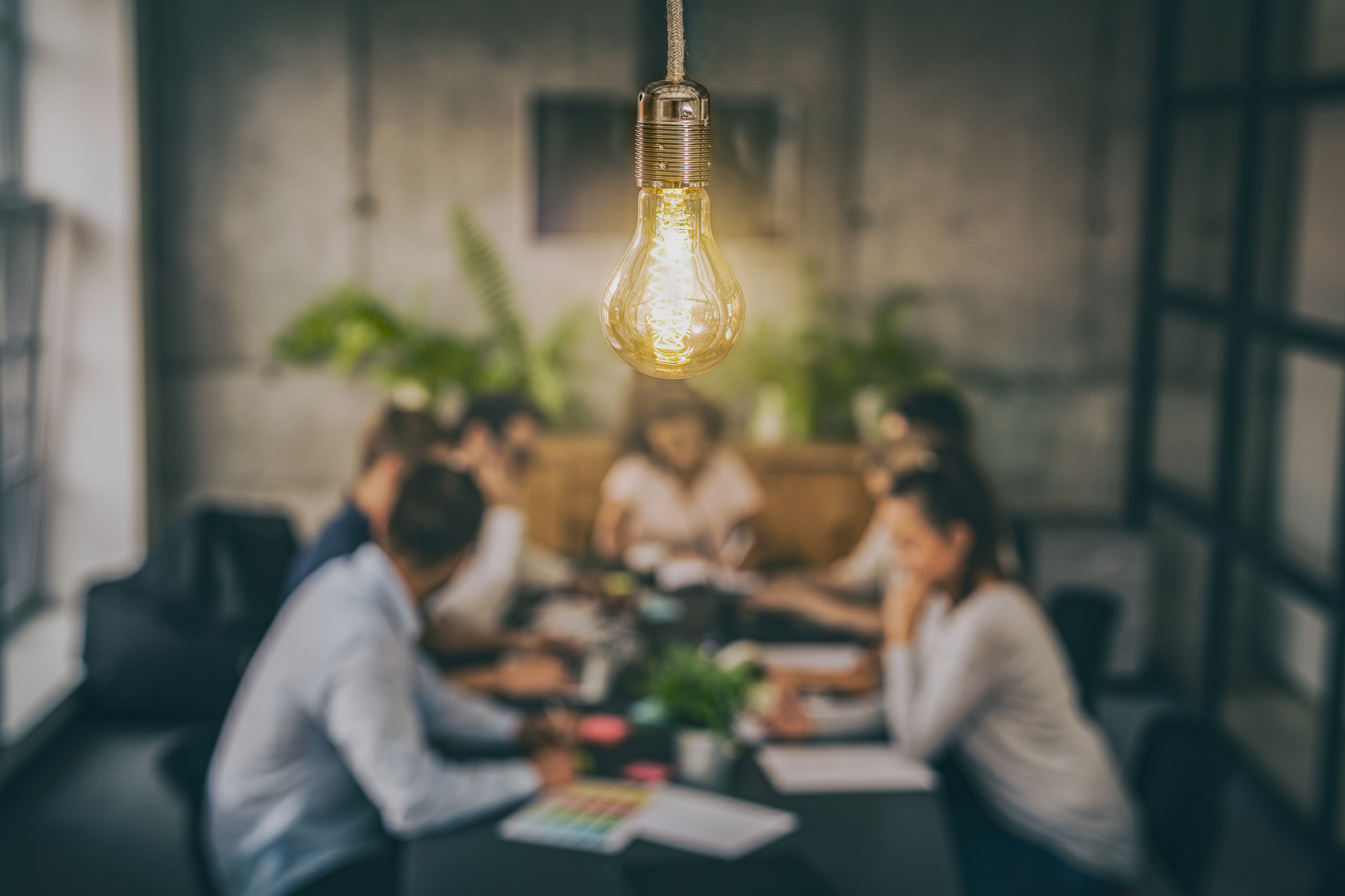 Lightbulb In Front of a First Party Advertising Team
